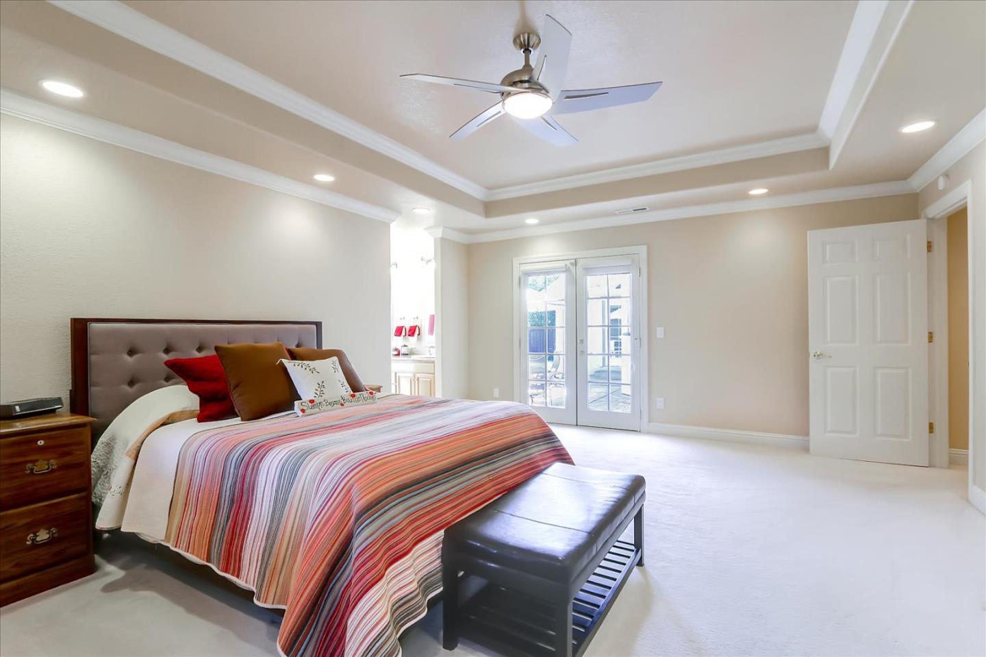 814 Savannah Circle Walnut Creek, CA 94598 - Photo 13 of 41 a bedroom with a bed and a chandelier