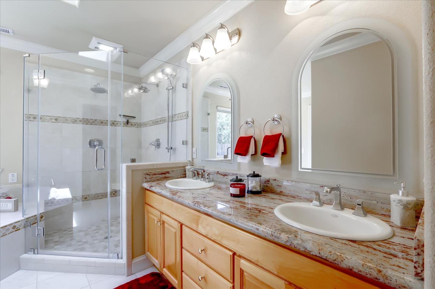 814 Savannah Circle Walnut Creek, CA 94598 - Photo 14 of 41 a bathroom with a granite countertop double vanity sink mirror and shower
