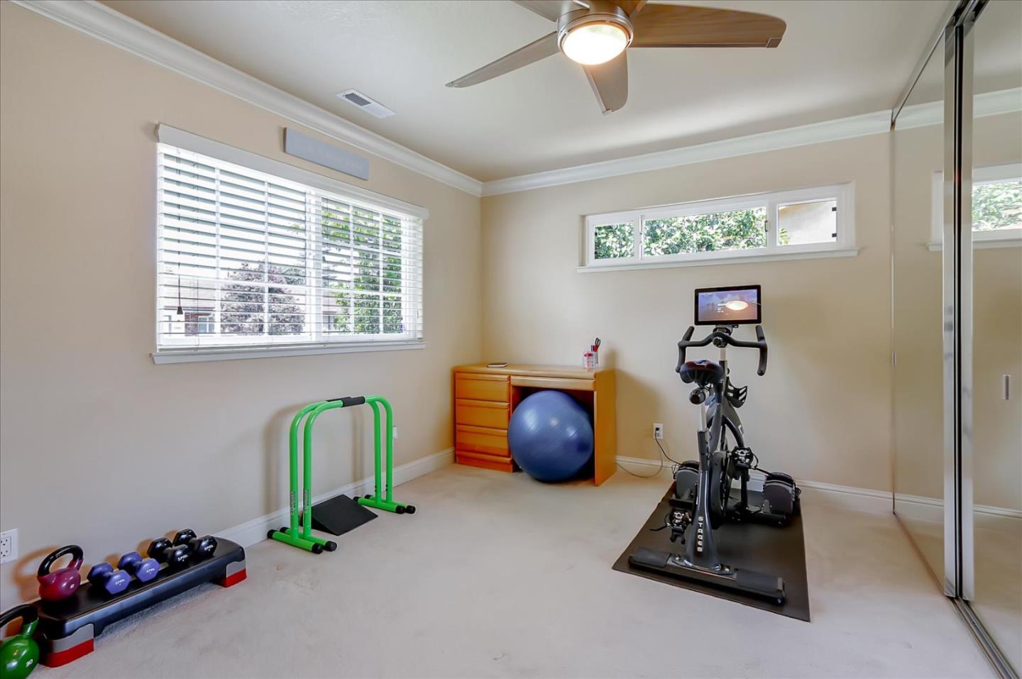 814 Savannah Circle Walnut Creek, CA 94598 - Photo 19 of 41 a room with gym equipment and a large window
