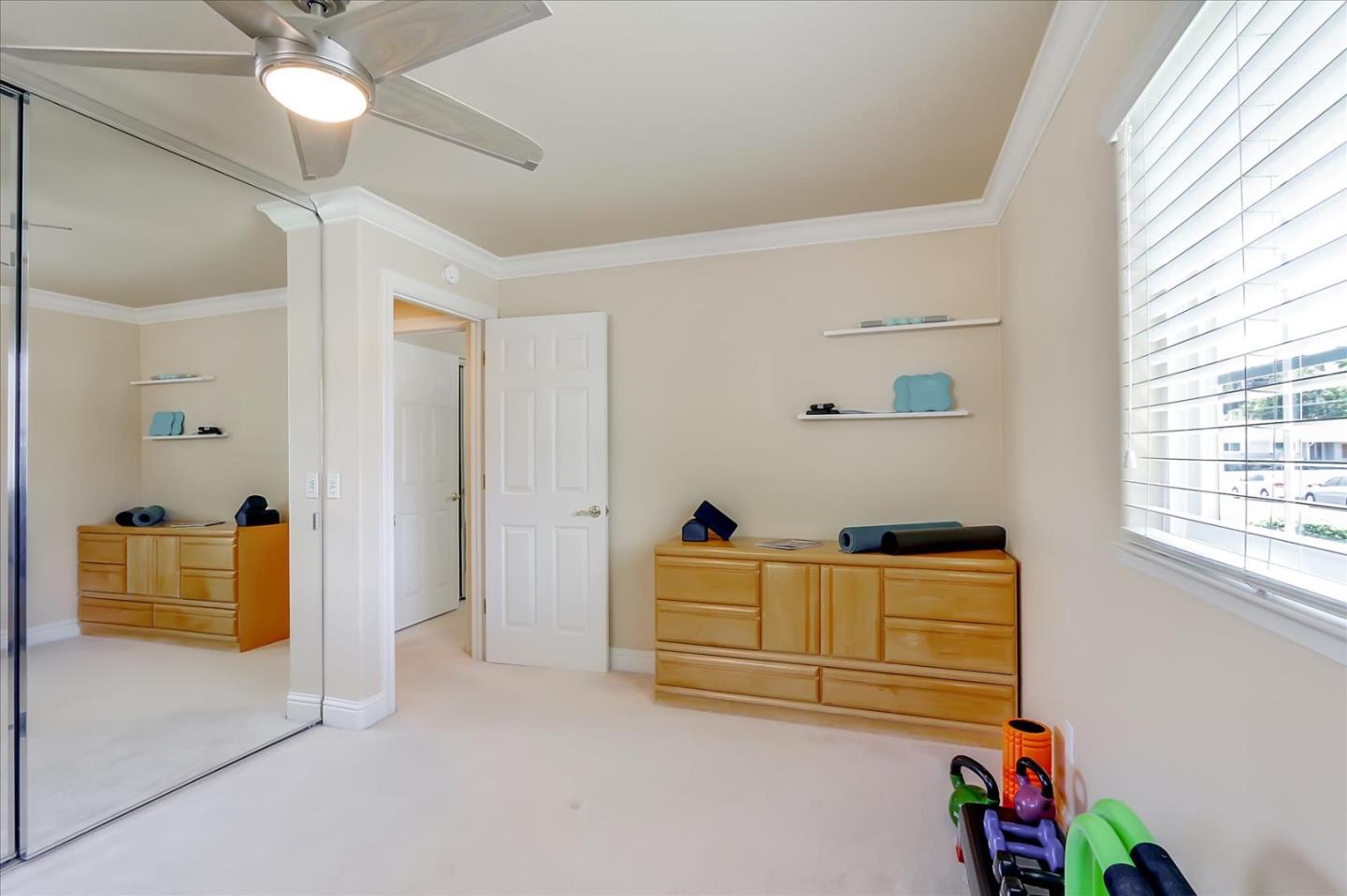 814 Savannah Circle Walnut Creek, CA 94598 - Photo 20 of 41 a view of walk in closet with window and chandelier