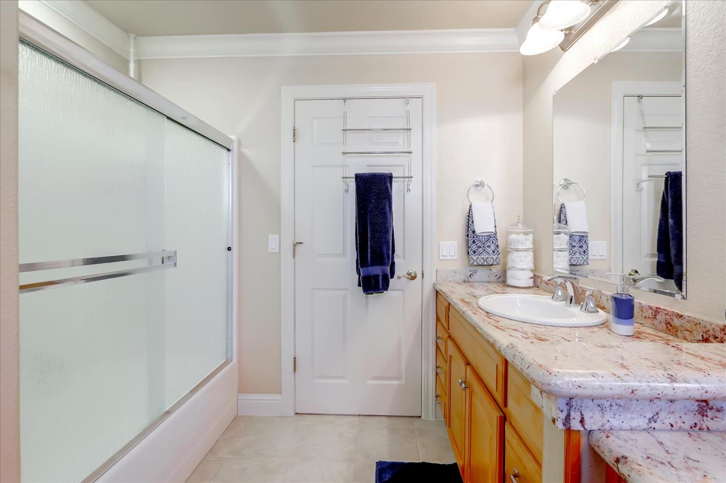814 Savannah Circle Walnut Creek, CA 94598 - Photo 24 of 41 a bathroom with a double vanity sink a mirror and a shower