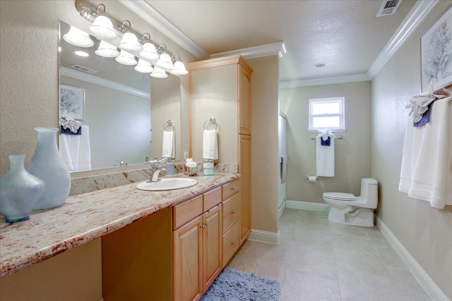 814 Savannah Circle Walnut Creek, CA 94598 - Photo 25 of 41 a spacious bathroom with a granite countertop sink a toilet and a large mirror