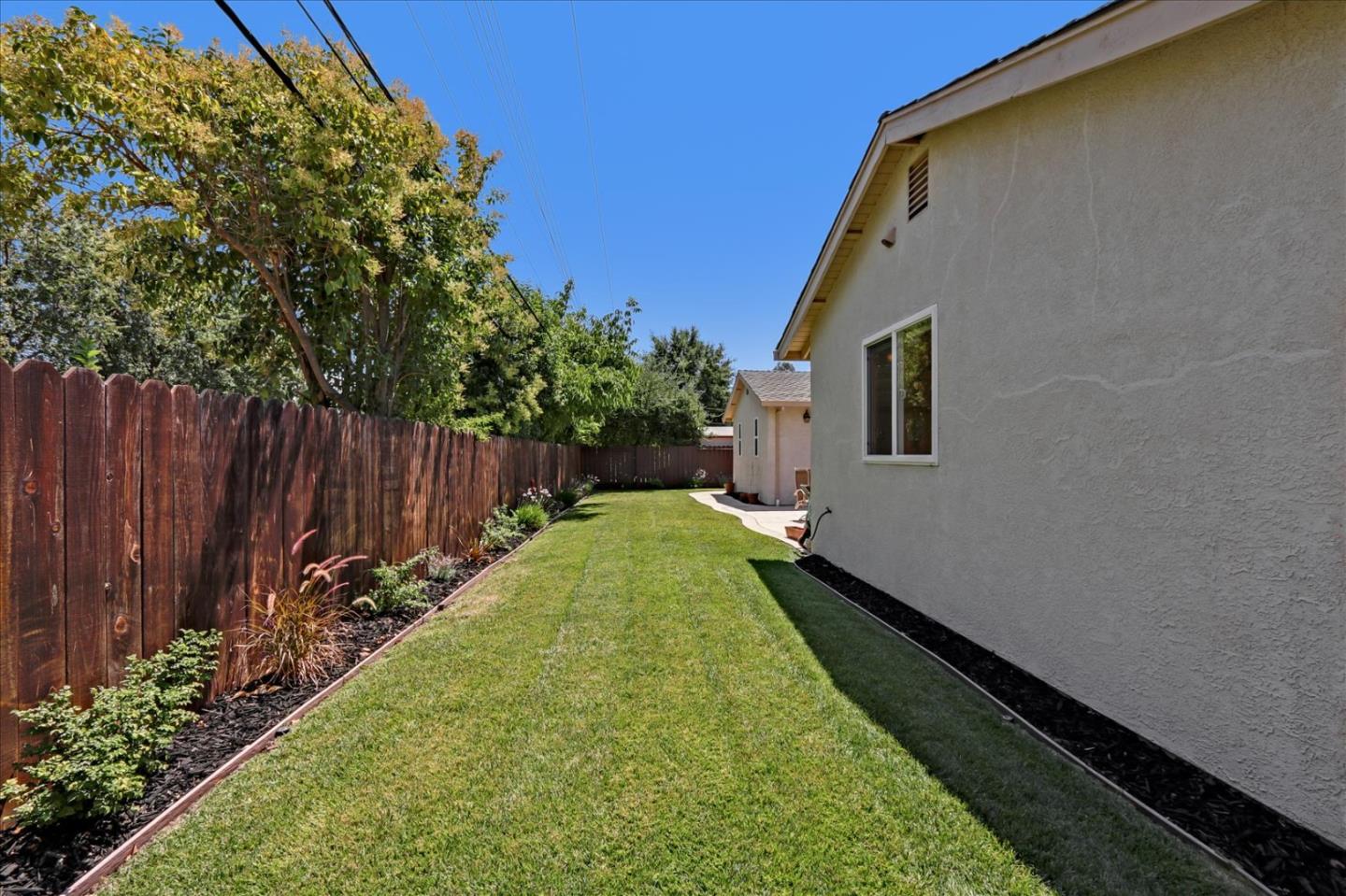 814 Savannah Circle Walnut Creek, CA 94598 - Photo 29 of 41 a view of a backyard with wooden fence and a bench