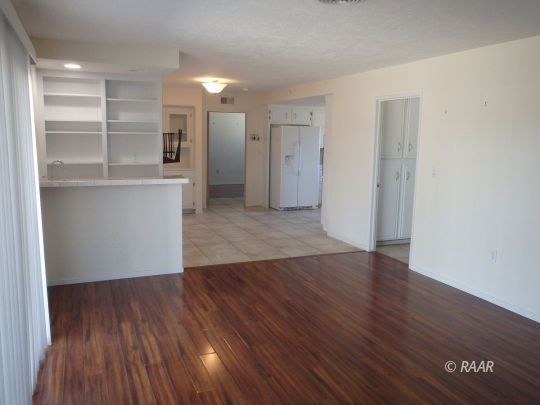 516 Scott Street Ridgecrest, CA 93555 - Photo 15 of 35 a view of a room with wooden floors and led lights