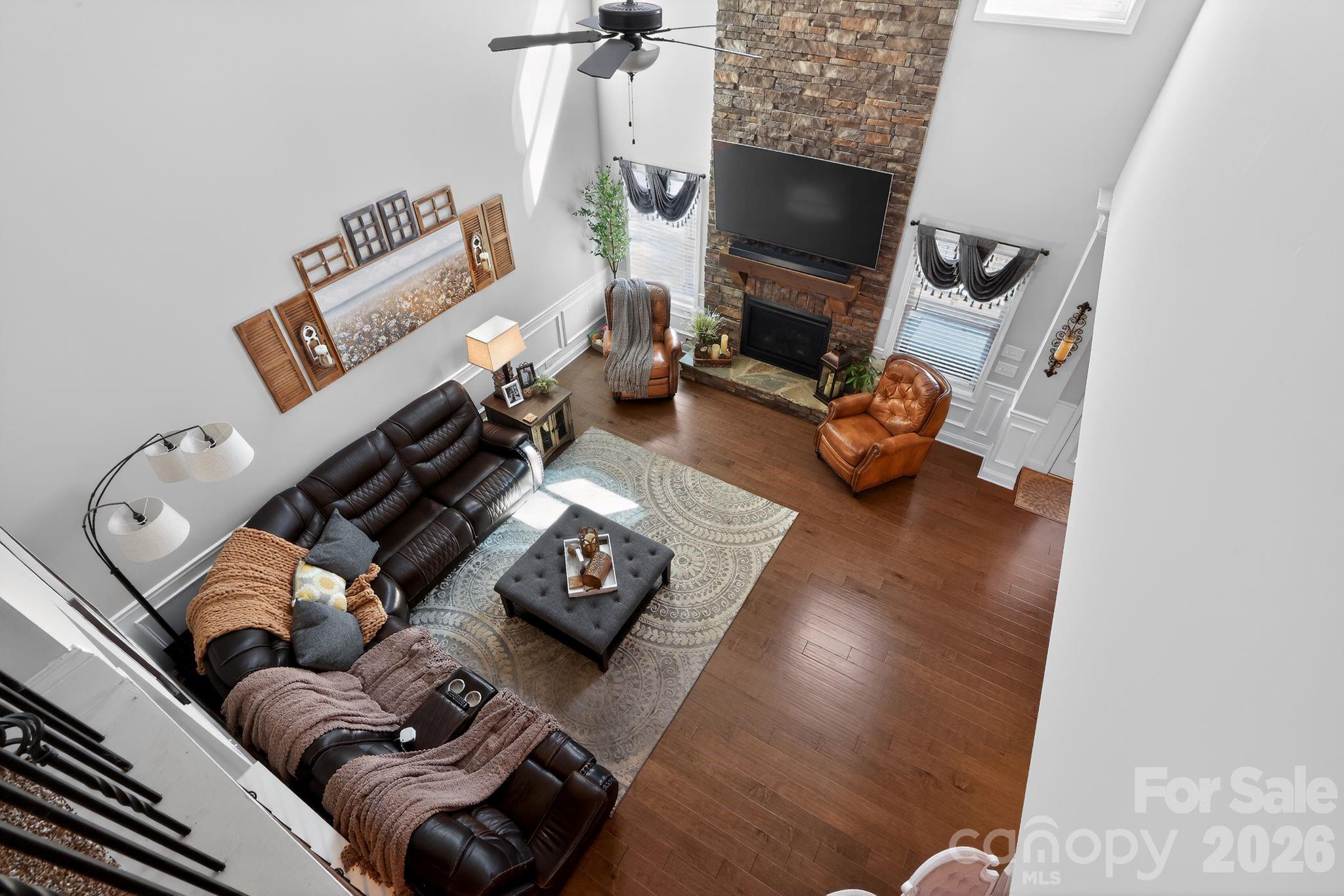 1 Foxmoor Court Simpsonville, SC 29680 - Photo 12 of 36 a living room with furniture and a flat screen tv