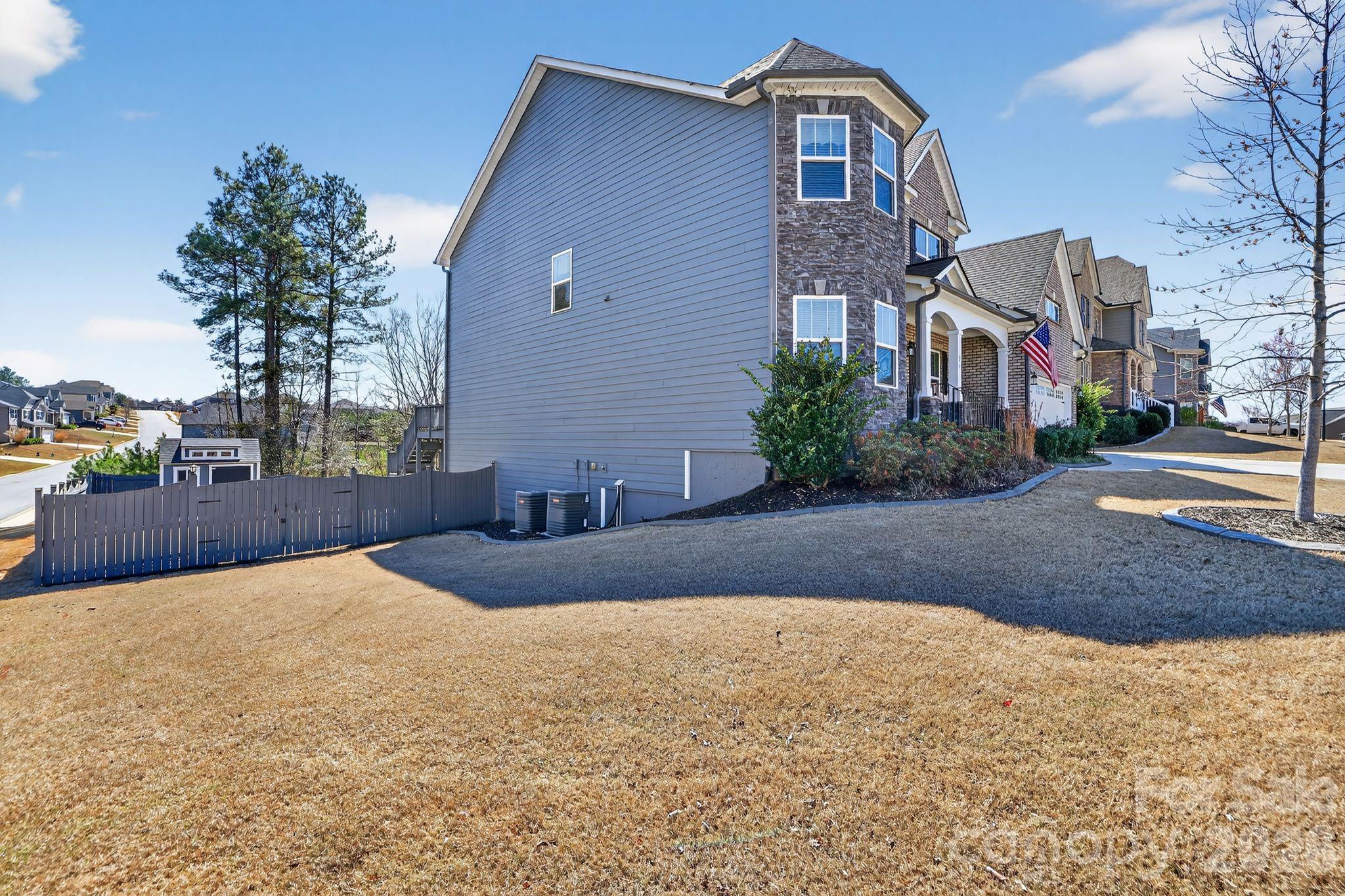 1 Foxmoor Court Simpsonville, SC 29680 - Photo 2 of 36 a front view of a house with a yard and garage