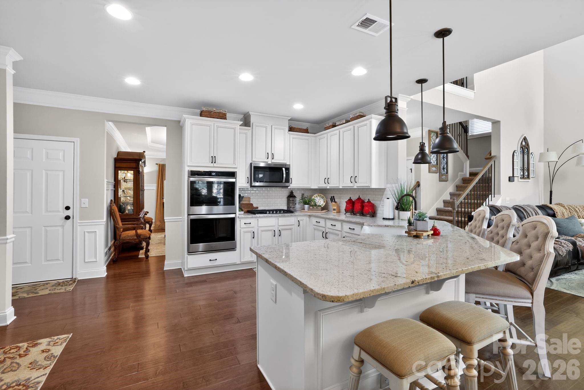 1 Foxmoor Court Simpsonville, SC 29680 - Photo 22 of 36 a kitchen with stainless steel appliances granite countertop a stove refrigerator and cabinets