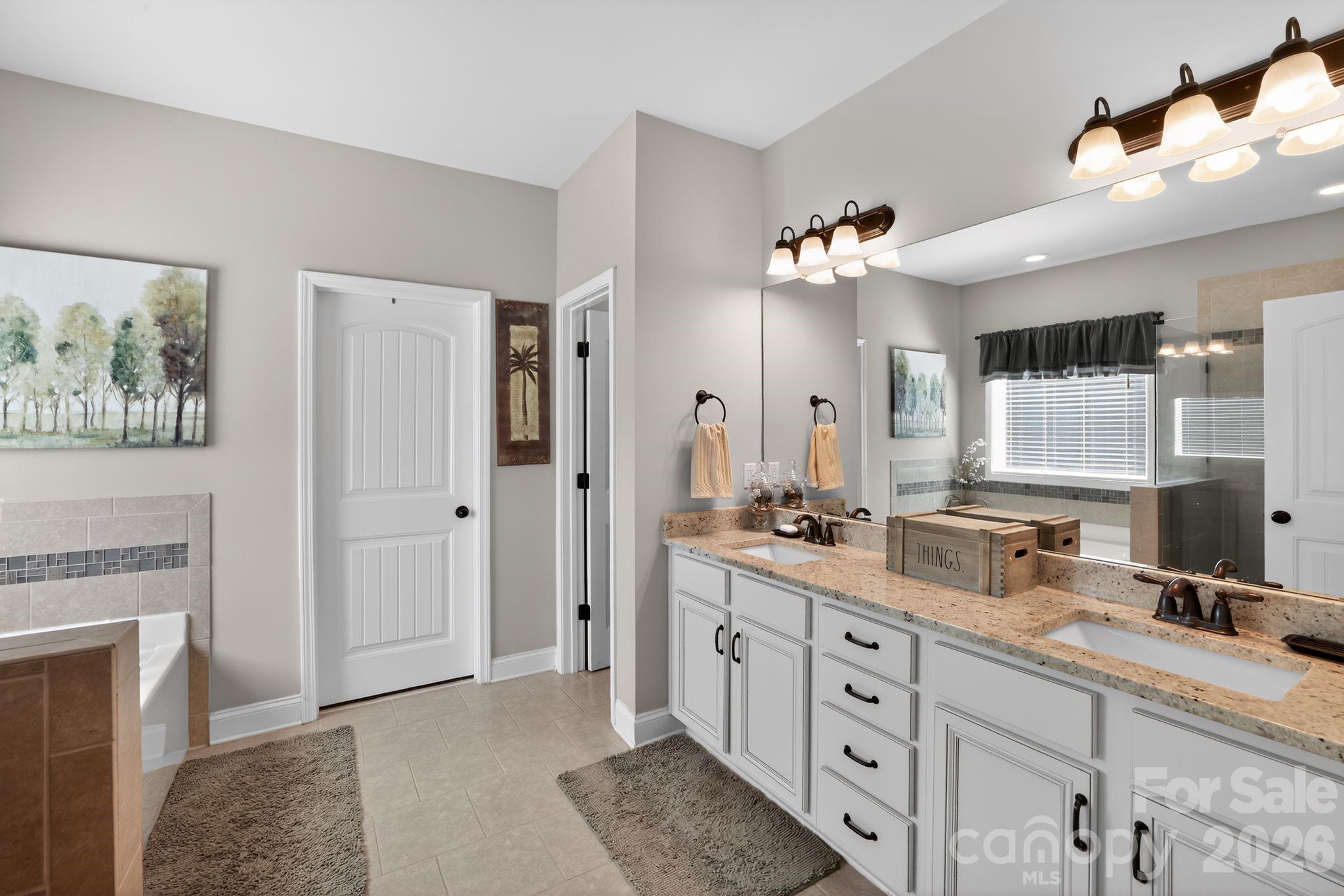 1 Foxmoor Court Simpsonville, SC 29680 - Photo 29 of 36 a spacious bathroom with a double vanity sink double and a mirror