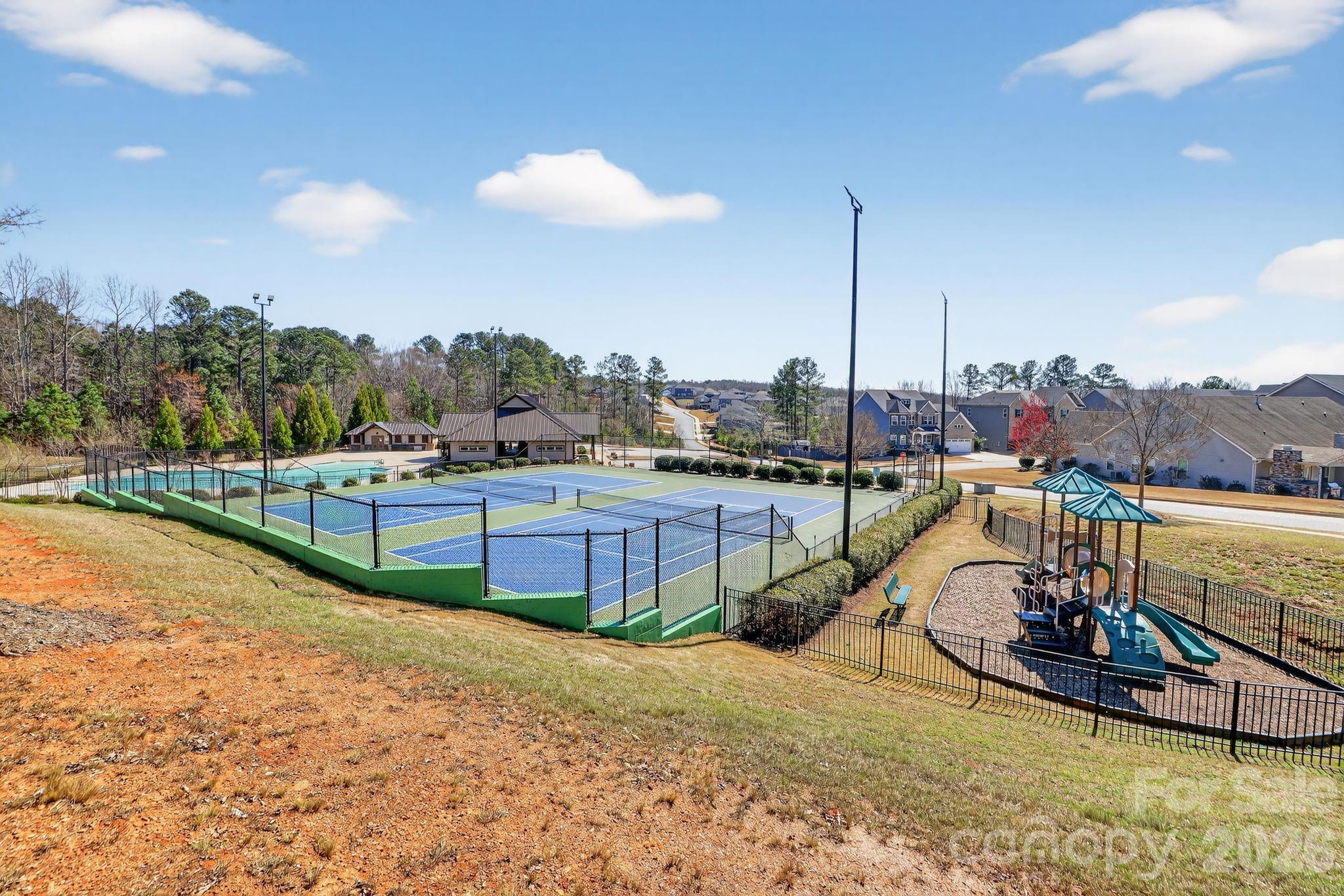 1 Foxmoor Court Simpsonville, SC 29680 - Photo 34 of 36 a view of a swimming pool with a lake