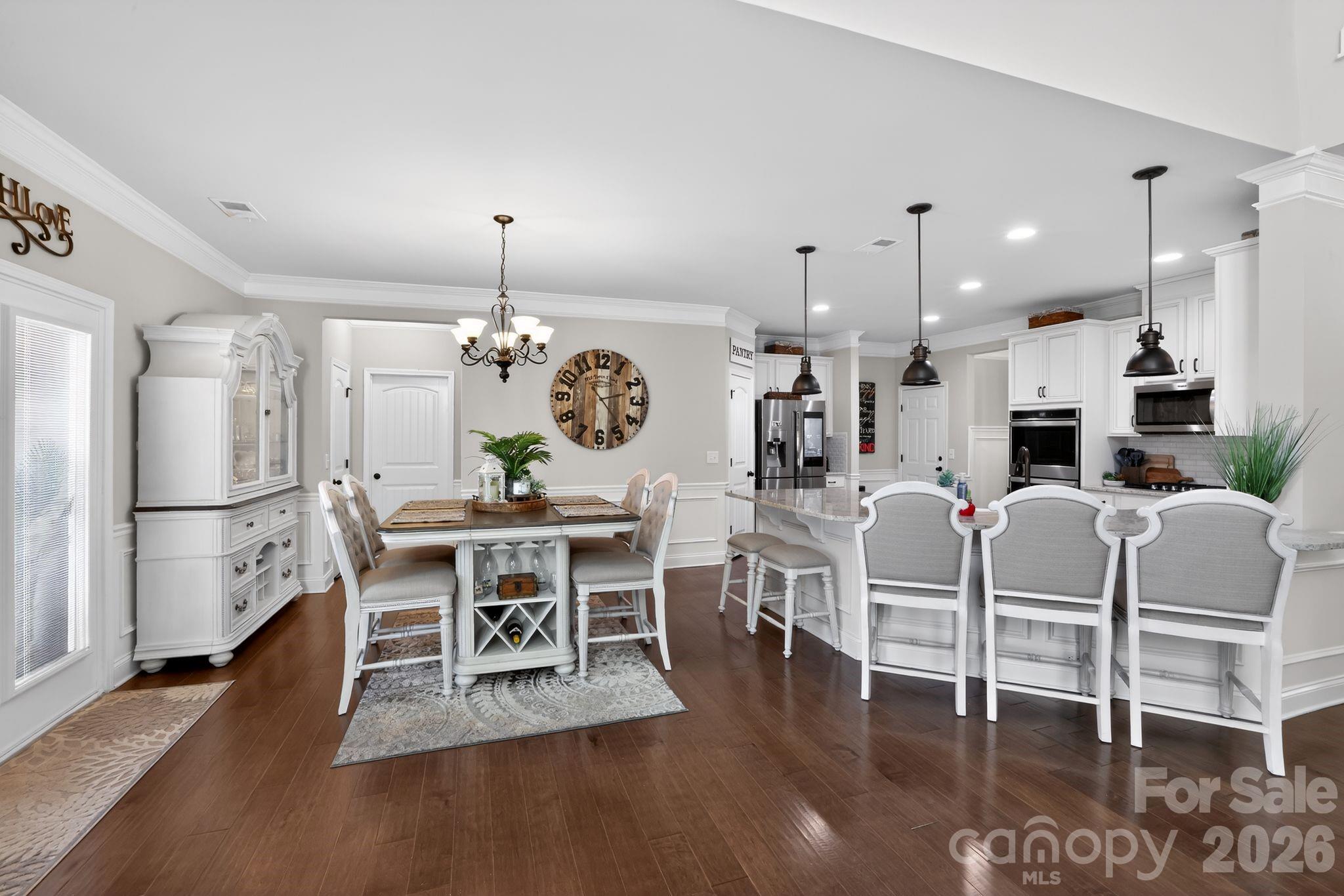 1 Foxmoor Court Simpsonville, SC 29680 - Photo 7 of 36 a living room with furniture a wooden floor and kitchen view