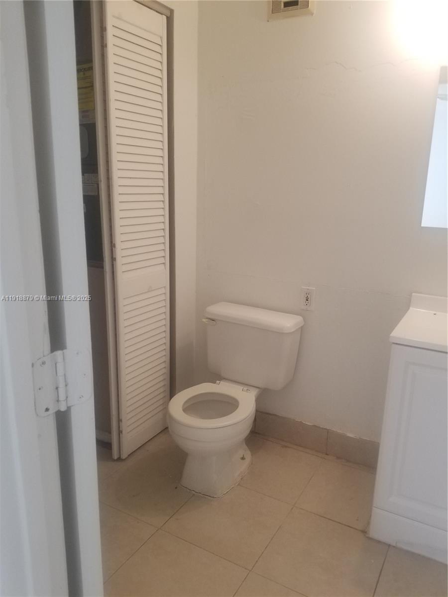 15 Crossings Circle, Unit A Boynton Beach, FL 33435 - Photo 7 of 14 a white toilet sitting next to a shower