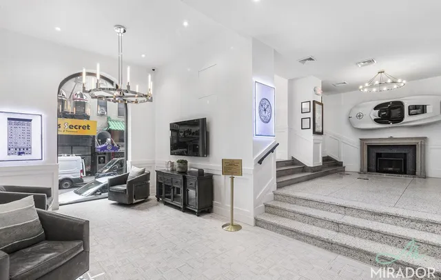 a kitchen with cabinets stainless steel appliances and sink