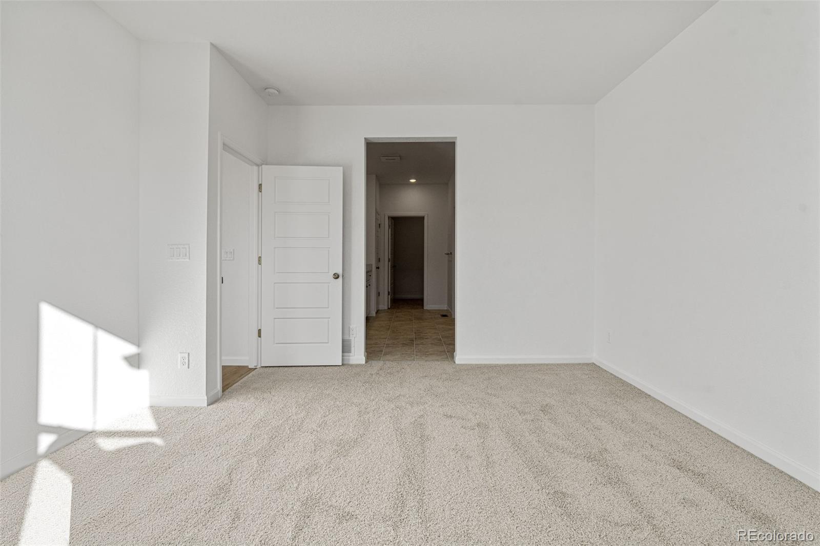 23966 E River Aurora, CO 80019 - Photo 22 of 50 an empty room with an entryway