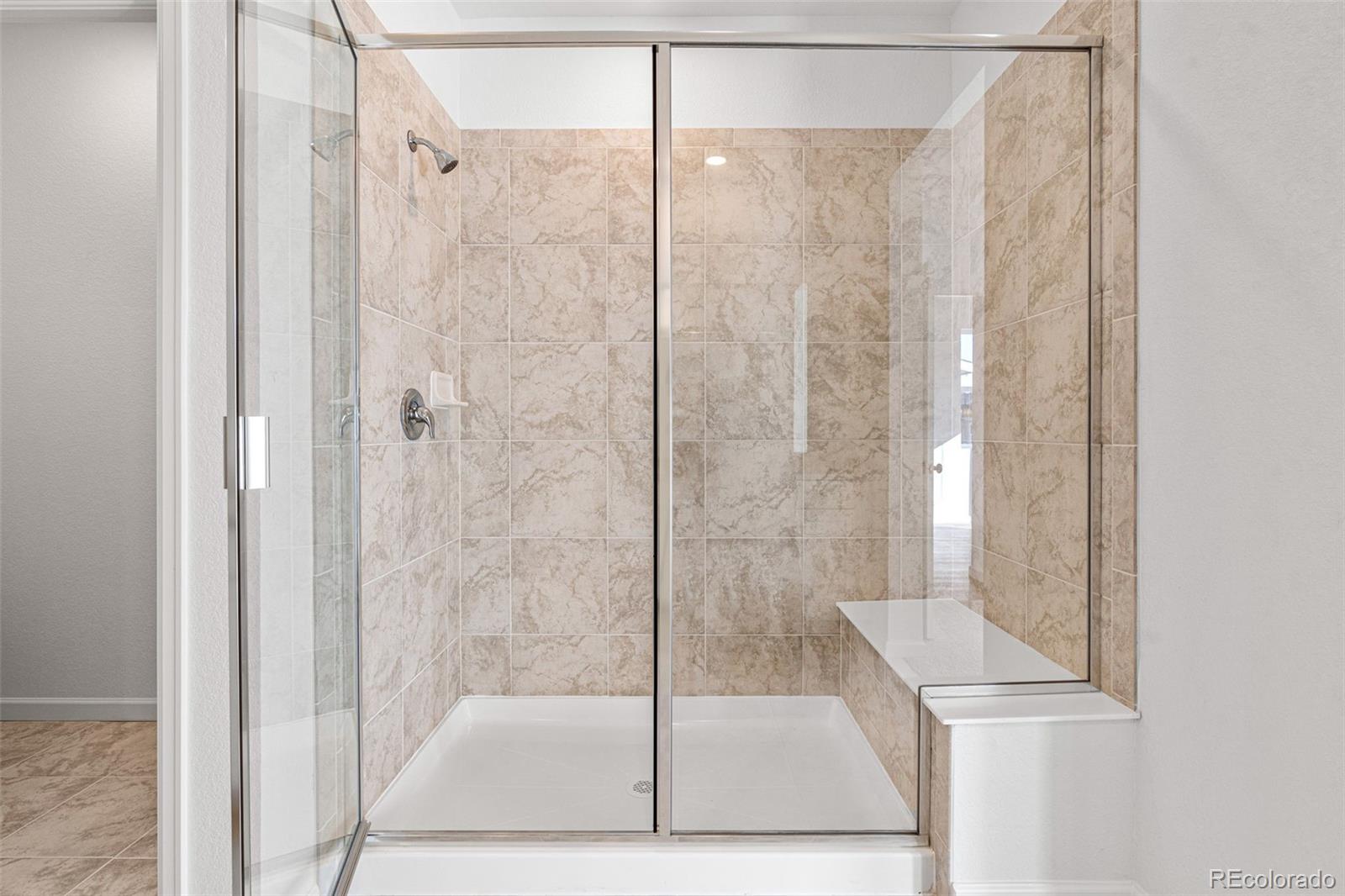 23966 E River Aurora, CO 80019 - Photo 25 of 50 a bathroom with a shower