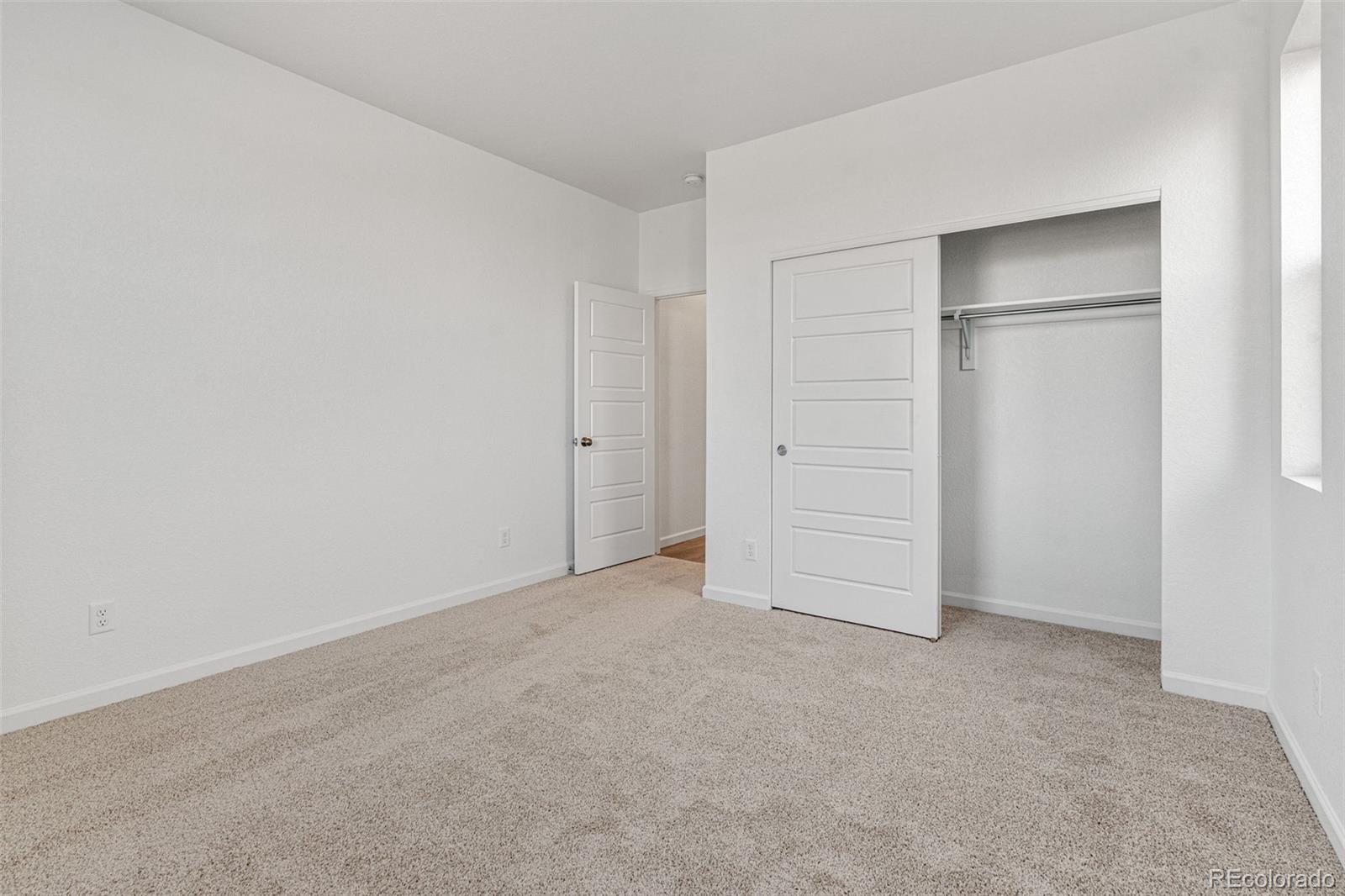 23966 E River Aurora, CO 80019 - Photo 28 of 50 an empty room with closet area