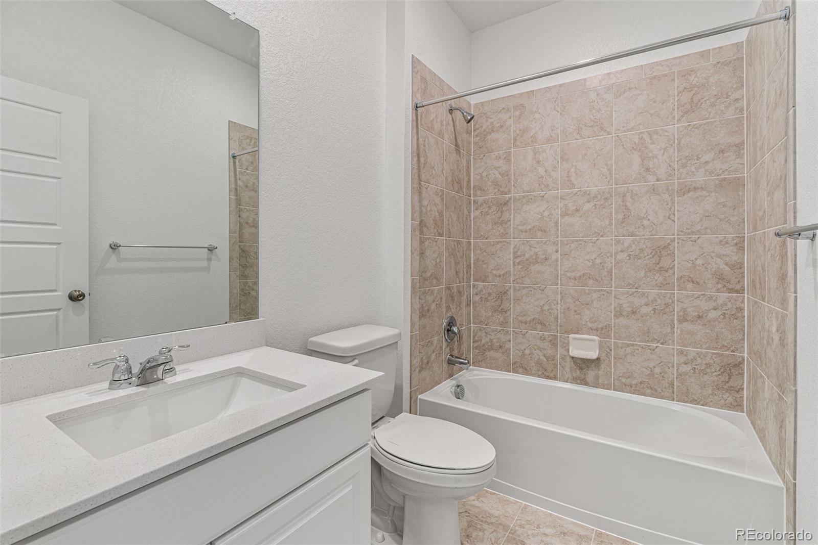 23966 E River Aurora, CO 80019 - Photo 29 of 50 a bathroom with a sink toilet and shower