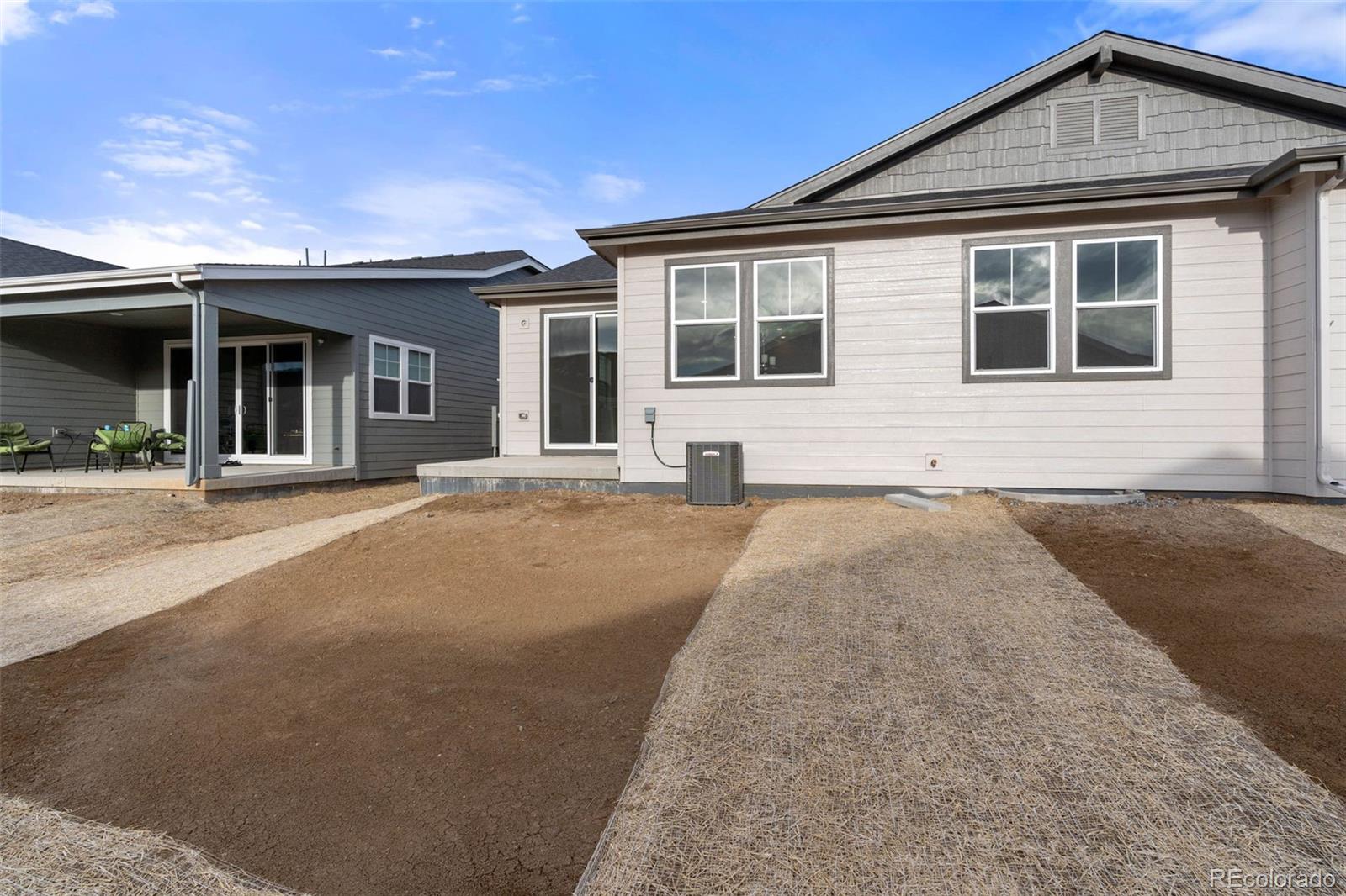 23966 E River Aurora, CO 80019 - Photo 34 of 50 a front view of a house with a outdoor space