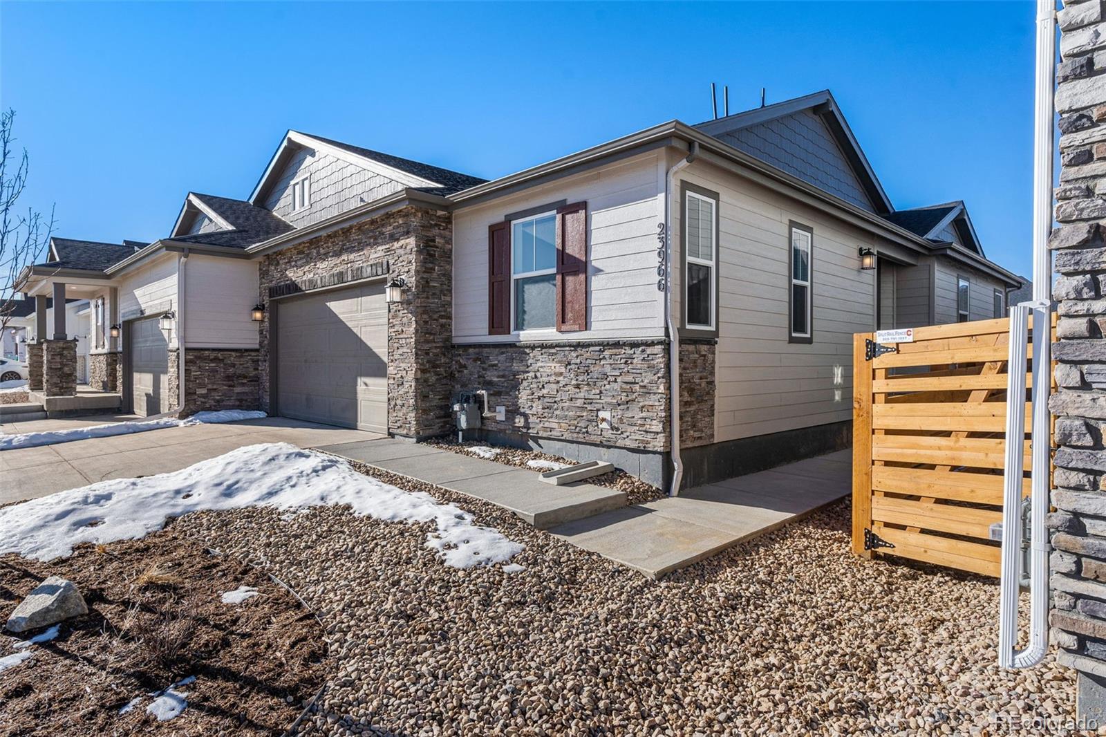 23966 E River Aurora, CO 80019 - Photo 38 of 50 a front view of a house with a yard