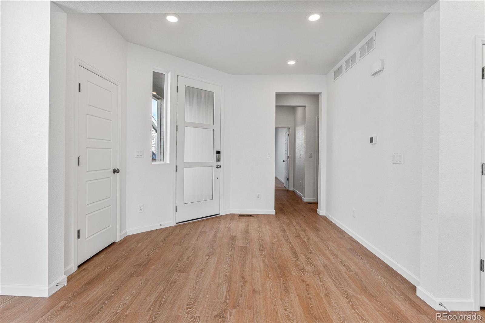 23966 E River Aurora, CO 80019 - Photo 4 of 50 a view of an empty room with wooden floor
