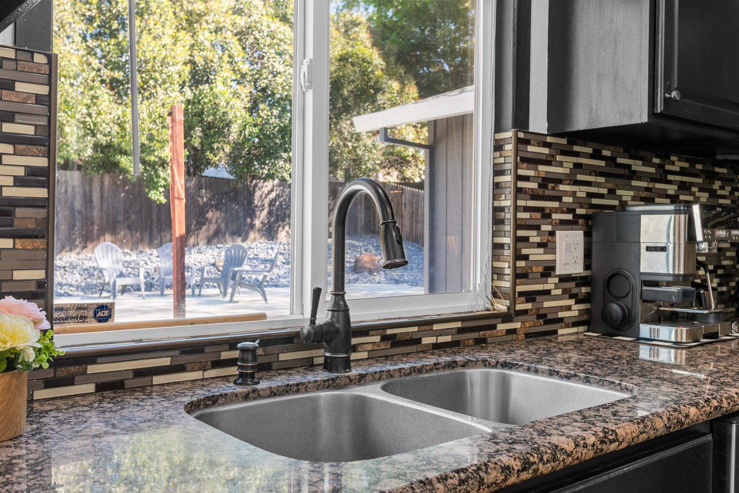 6321 Paco Court Citrus Heights, CA 95621 - Photo 12 of 36 a kitchen with a sink and a large window