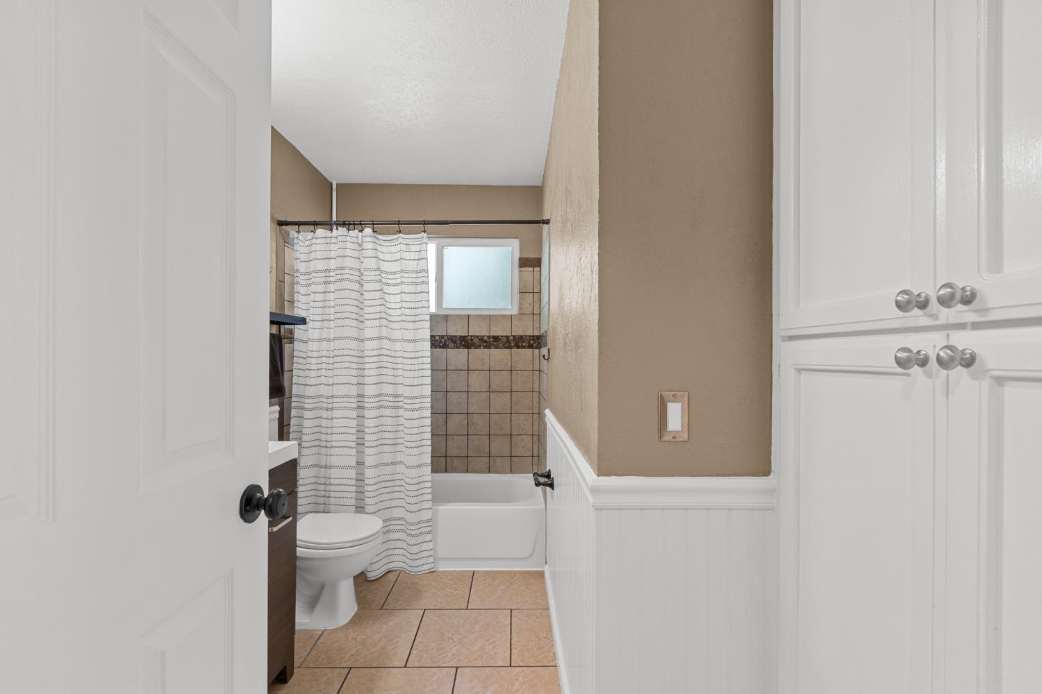 6321 Paco Court Citrus Heights, CA 95621 - Photo 14 of 36 a bathroom with a granite countertop white toilet and a shower
