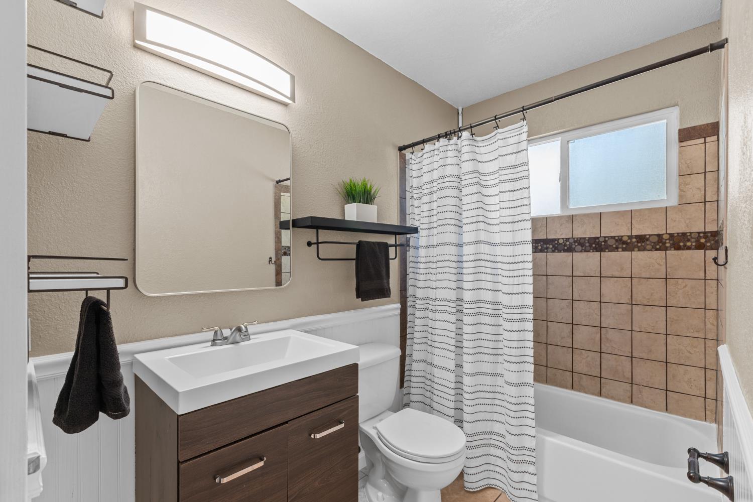 6321 Paco Court Citrus Heights, CA 95621 - Photo 15 of 36 a bathroom with a sink toilet and shower