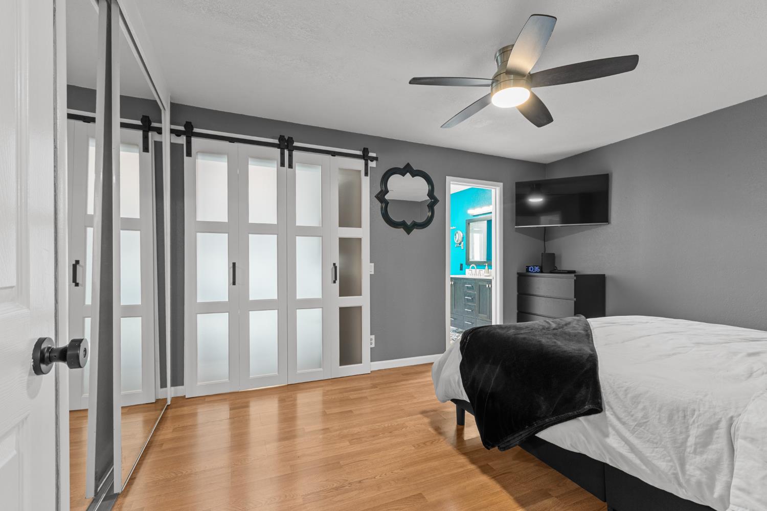 6321 Paco Court Citrus Heights, CA 95621 - Photo 19 of 36 a bedroom with a bed closet and a flat tv screen