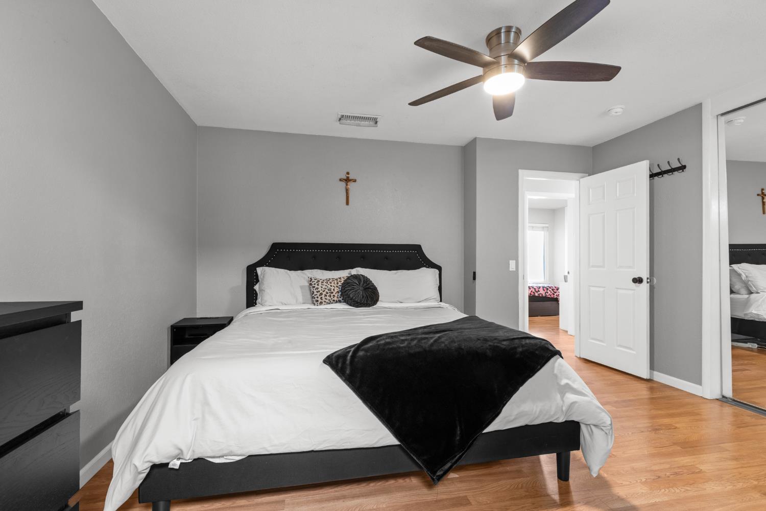 6321 Paco Court Citrus Heights, CA 95621 - Photo 20 of 36 a bedroom with a bed and a chandelier