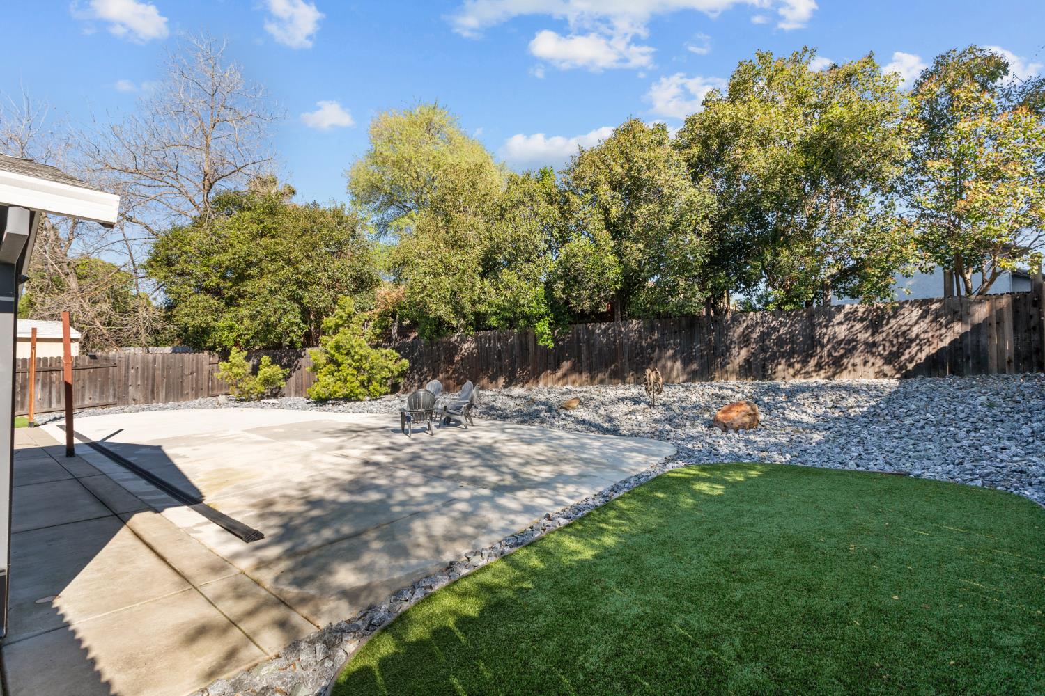 6321 Paco Court Citrus Heights, CA 95621 - Photo 27 of 36 a view of a yard with plants and a bench
