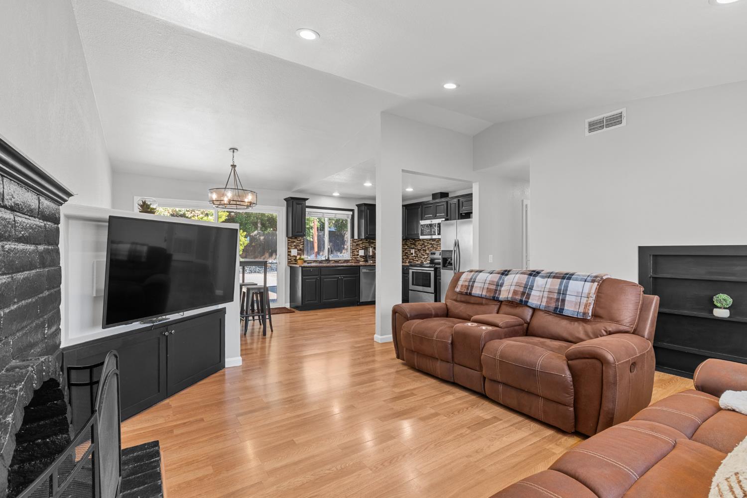 6321 Paco Court Citrus Heights, CA 95621 - Photo 9 of 36 a living room with furniture and a flat screen tv