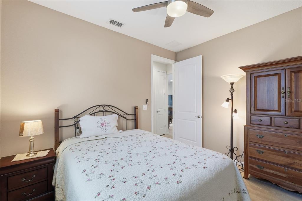 799 Asturias Road Davenport, FL 33837 - Photo 12 of 19 a bedroom with a bed and a dresser