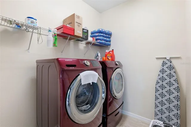 a utility room with dryer and washer