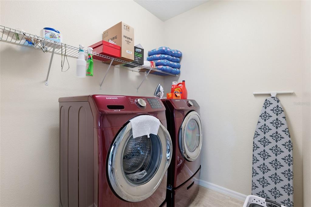 799 Asturias Road Davenport, FL 33837 - Photo 15 of 19 a utility room with dryer and washer