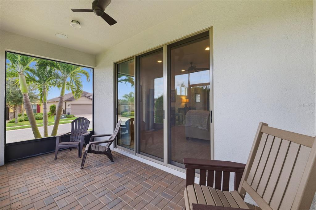 799 Asturias Road Davenport, FL 33837 - Photo 17 of 19 a view of a hallway with chairs and a dining room