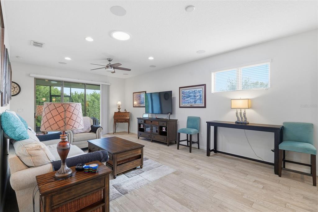 799 Asturias Road Davenport, FL 33837 - Photo 5 of 19 a living room with furniture and a wooden floor