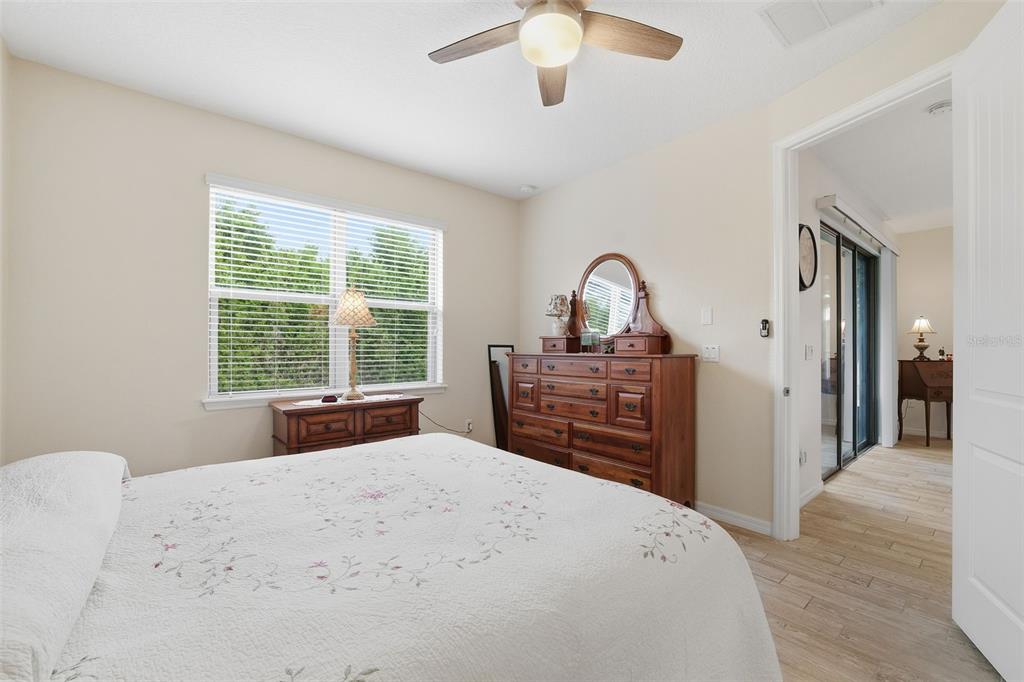 799 Asturias Road Davenport, FL 33837 - Photo 10 of 19 a spacious bedroom with a bed and a dresser