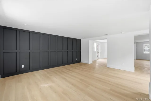 a view of a big room with wooden floor and closet