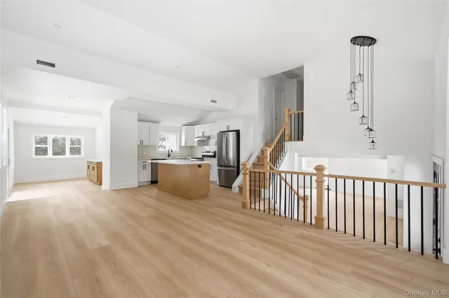 a view of a kitchen with furniture and a window