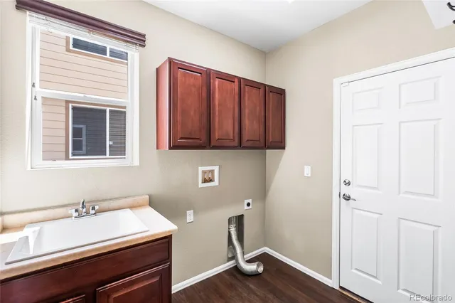 a room with a table and wooden floor