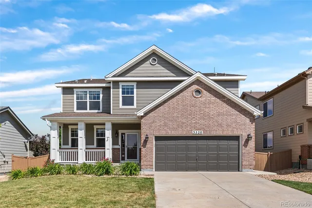 a front view of a house with yard