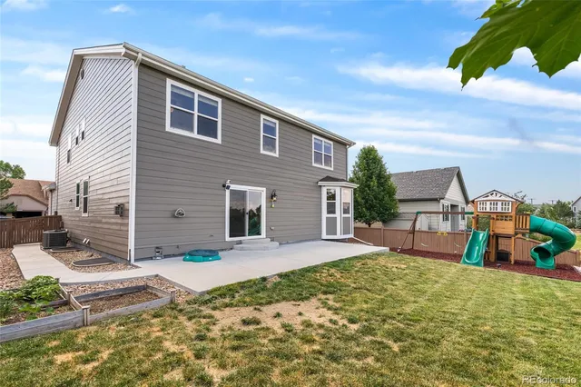 a front view of house with yard and seating area