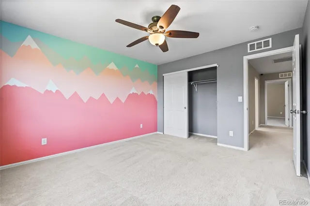 a view of a big room with closet and a large window