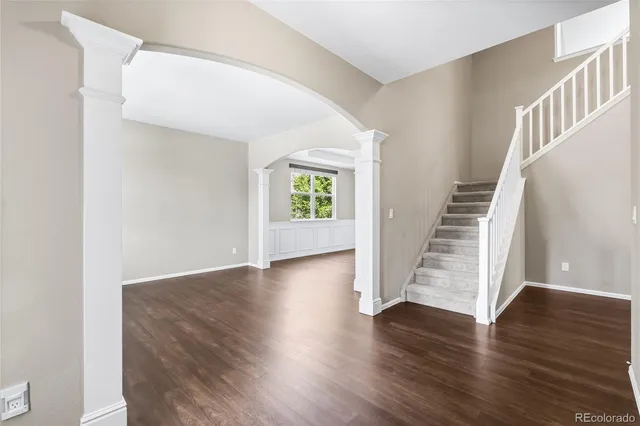 a view of an entryway with wooden floor