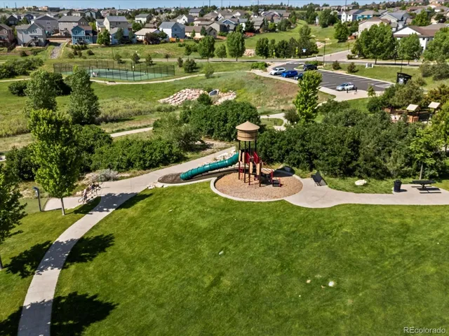 an aerial view of a house with outdoor space