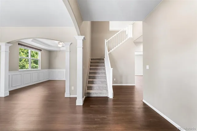 a view of an entryway with wooden floor and windows