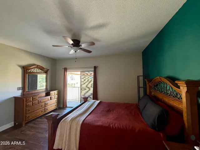 a bed room with a bed and a chandelier