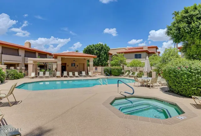 a house view with a seating space and a yard