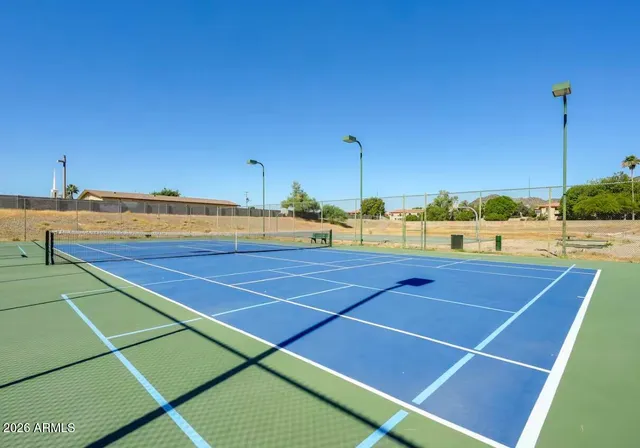 a view of an outdoor space and tennis court