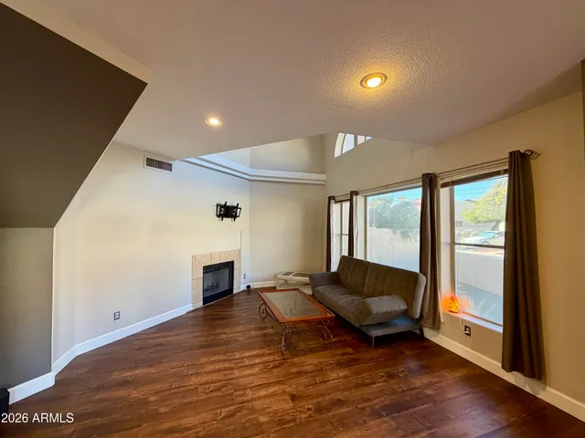 a living room with a couch and a fireplace