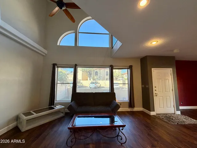 a living room with furniture and a window